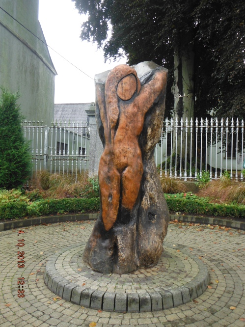 The sculpture “Angel of the Past” is by a local artist, Patrick Morris, carved from a sycamore tree which stood here when Charles Stewart Parnell addressed the people of Kells about land rights for Irish tenants and Home Rule.