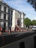 The Cenotaph is located in the centre of the wide thoroughfare of Whitehall
