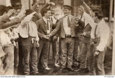September 1916. 3970 Private (Pte) Martin O'Meara being congratulated by fellow hospital patients, at Wandsworth, all wearing 'hospital blues', following the announcement of his Victoria Cross award. (Image Australian War Memorial, Public Domain)