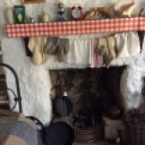 The open fireplace with clothes drying above