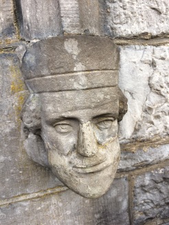 One of two carved faces at main entrance